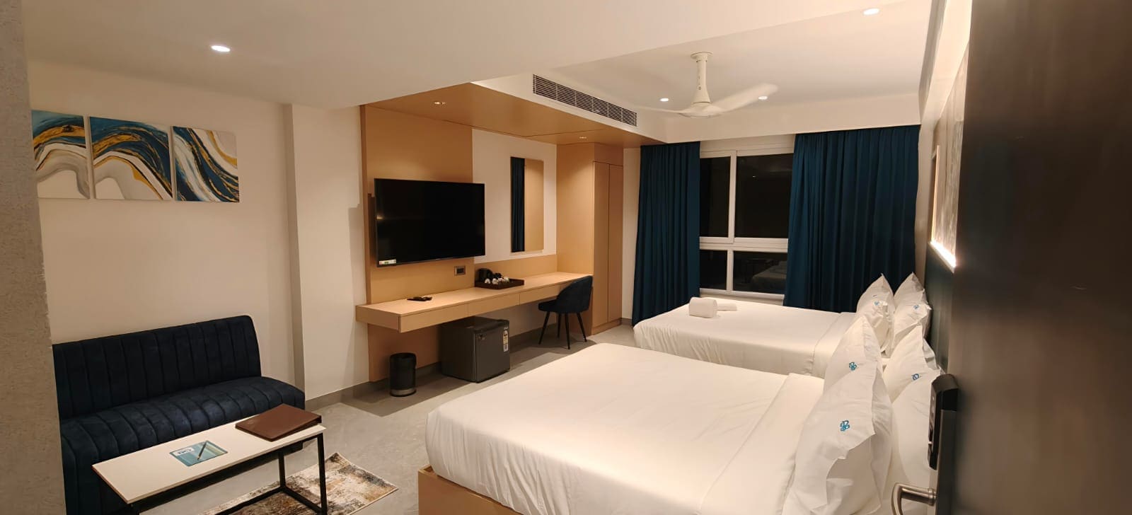 Family room with modern lighting at Hotel Ocean Blue Vizag